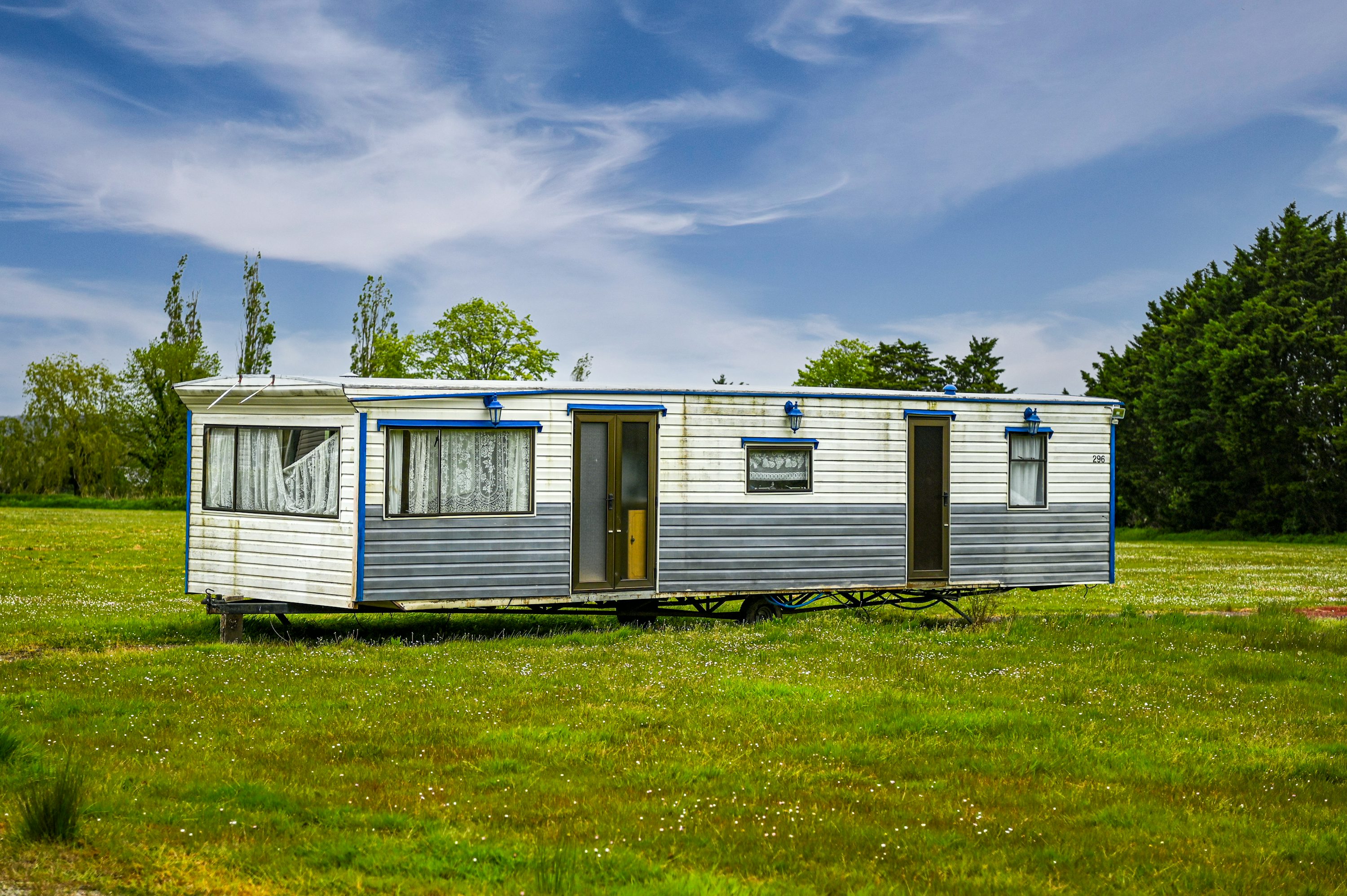 A mobile home on a grassy property